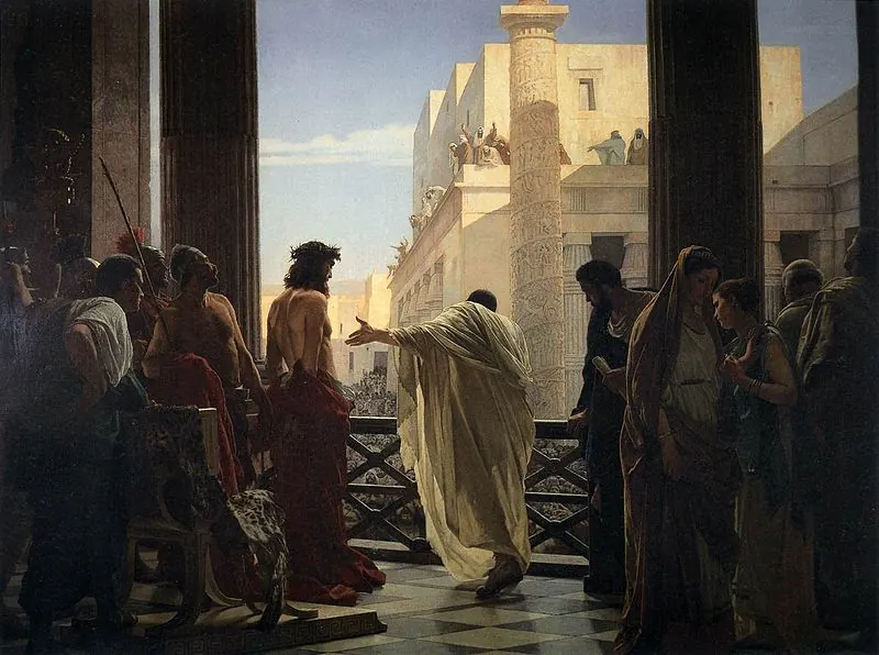 An official in a white robe turns from a stone balcony and gestures down toward an unseen crowd. Behind him a bound figure in a crown of thorns stands between soldiers, facing away.
